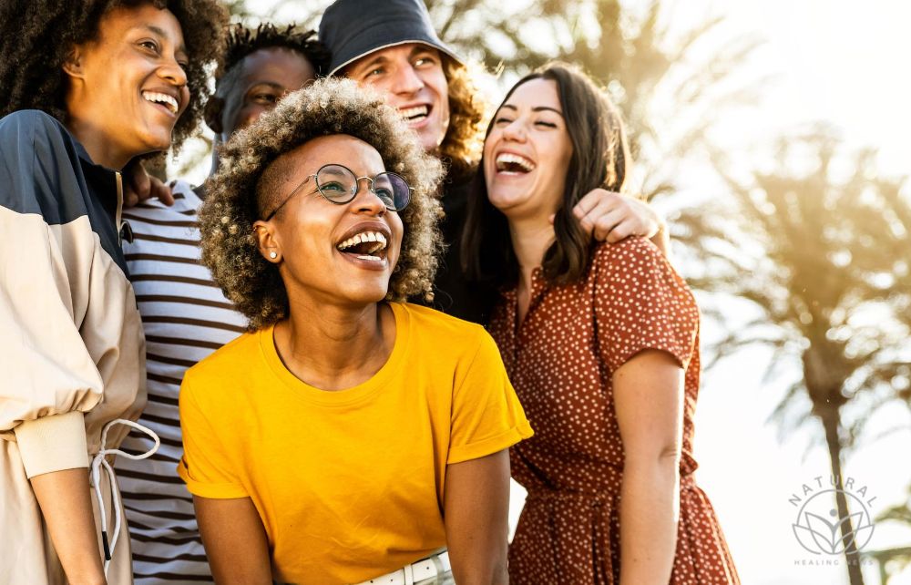 Five Tips to Help You Live Your Best Life With Intention, multiracial young people laughing out loud on a sunny day